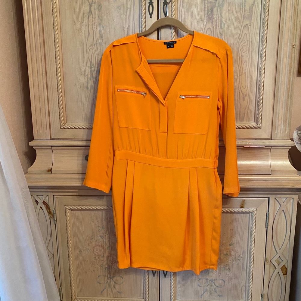 Orange Theory dress with zipper pocket detail.